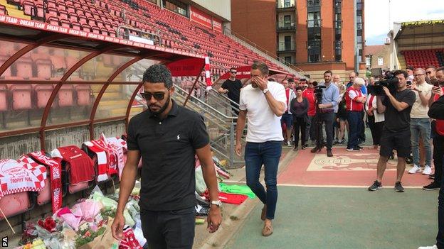 Leyton Orient captain Jobi McAnuff (left) and goalkeeper Dean Brill (right) laid shirts in the dugout at Brisbane Road on Sunday