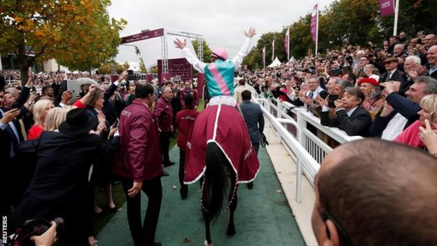 Frankie Dettori is congratulated by the crowd after finishing