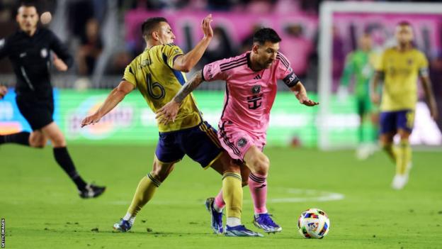 Inter Miami's Lionel Messi dribbles past Real Salt Lake's Brian Ojeda