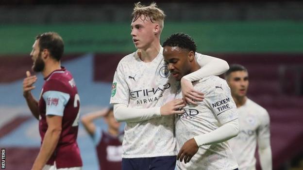 Cole Palmer and Raheem Sterling celebrate a Manchester City goal against Burnley in the Carabao Cup