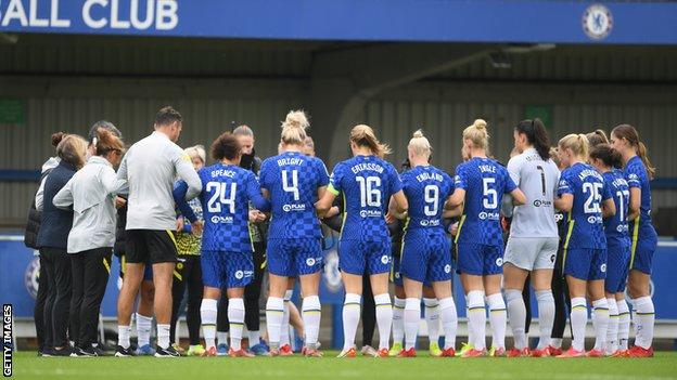 Chelsea players and coaches link arms