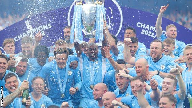 Fernandinho lifts the Premier League trophy after the dramatic victory over Aston Villa