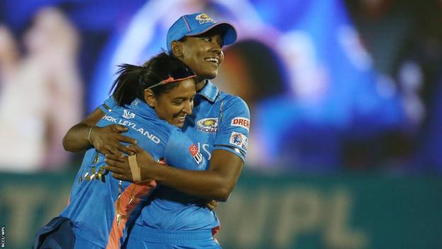 Harmanpreet Kaur and Hayley Matthews celebrate a wicket for Mumbai Indians