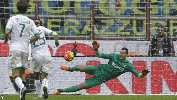 Sassuolo’s Domenico Berardi beats Inter Milan goalkeeper Samir Handanovic from the penalty spot