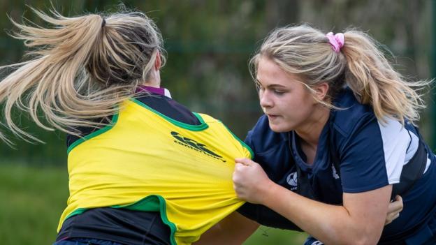 Dorothy Wall gets to grips with an Irish team-mate during Tuesday's training session in Dublin