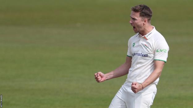 Will Davis celebrates taking a wicket for Leicestershire