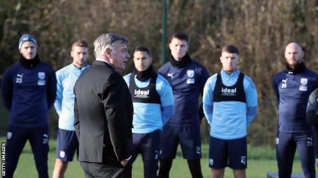 West Brom manager Sam Allardyce speaks to his players