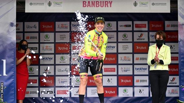 Marta Bastianelli celebrates with champagne on the podium