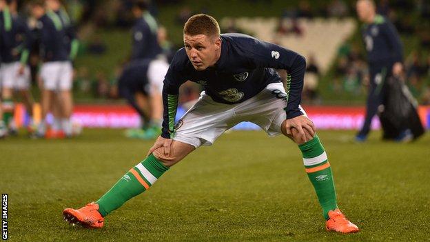 James McCarthy warms up against Wales
