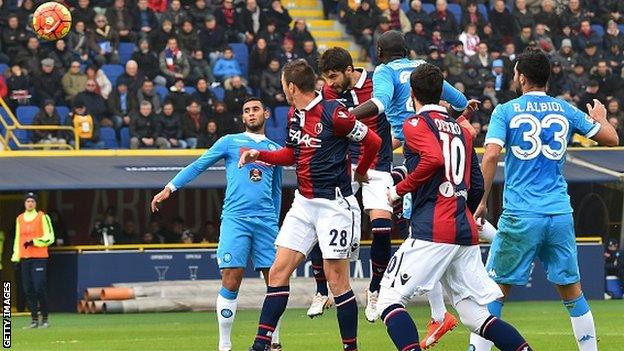 Bologna defender Luca Rossettini scores against Napoli
