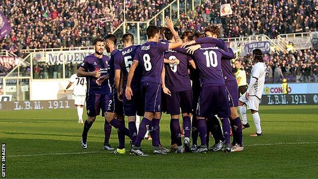 Fiorentina's players celebrate scoring against Udinese