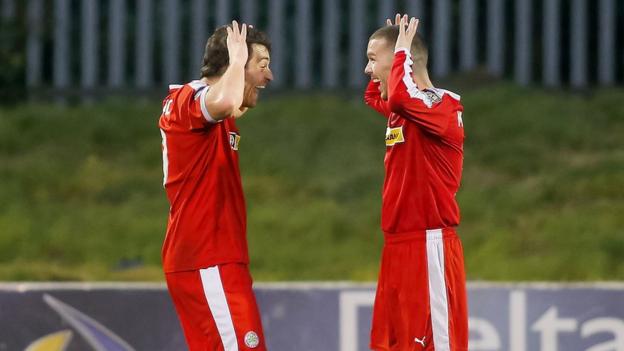 Cliftonville's double goalscorer David McDaid celebrates with Martin Donnelly during the 3-1 win over Ballinamallard