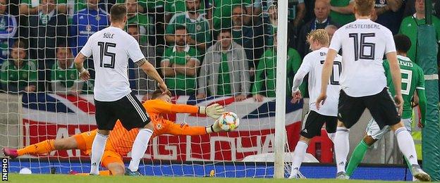 Northern Ireland keeper Bailey Peacock-Farrell makes a superb first-half save from Timo Werner