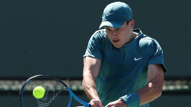 Jack Draper returns a ball in his Indian Wells first-round match