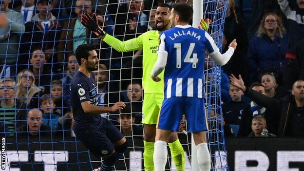 Ilkay Gündogan, left, celebrates opening the scoring against Brighton