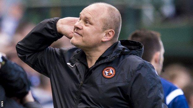 Dundee United manager Mixu Paatelainen cups his ear at Tannadice