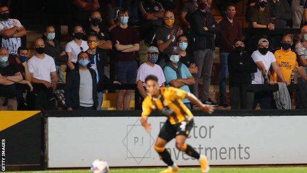 Cambridge United fans watch the game