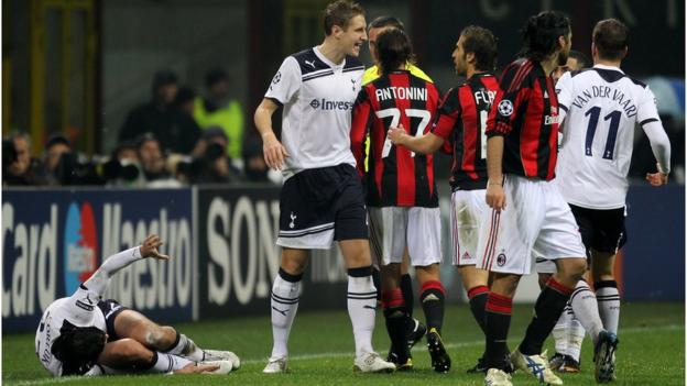 Tottenham and AC Milan players clash after a tackle from Mathieu Flamini (right from left) on Vedran Corluka (left, on the ground)