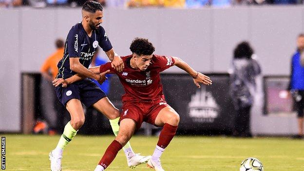 Manchester City's new signing Riyad Mahrez in action against Liverpool's Curtis Jones