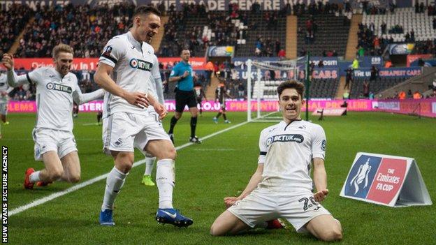 Daniel James celebrates his goal with Connor Roberts and Oli McBurnie