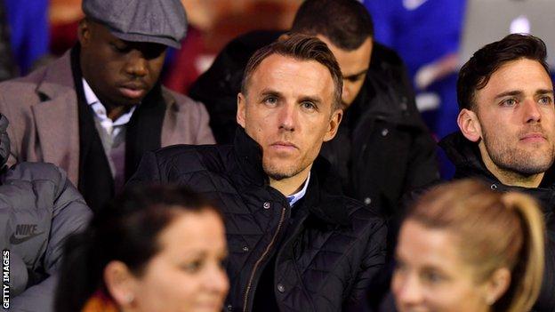 Phil Neville (centre)