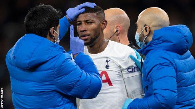 Emerson Royal of Tottenham Hotspur is checked for signs of concussion