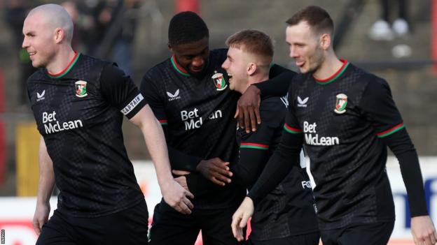 Glentoran players celebrate one of their goals in the 2-0 quarter-final win over Ballyclare Comrades