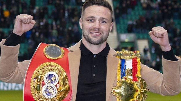 Scotland's world champion Josh Taylor celebrating with his belts