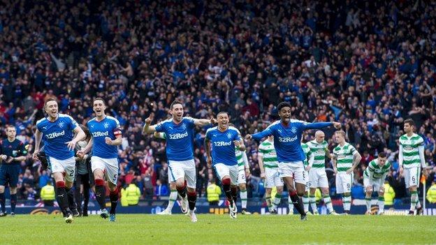 Rangers players celebrate beating Celtic on penalties
