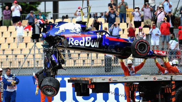 The car of Brendon Hartley of Toro Rosso loaded on to a truck