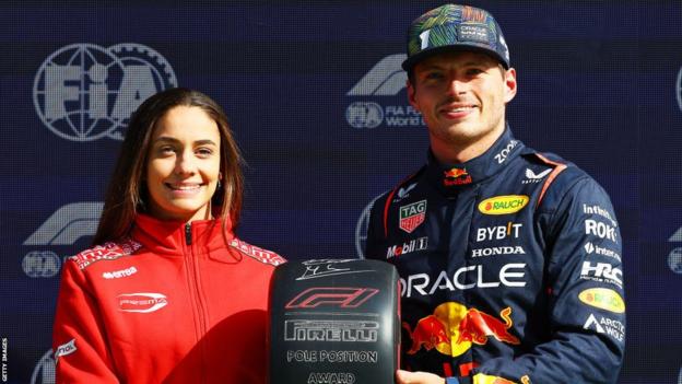 Pole position qualifier Max Verstappen is presented with the Pirelli Pole Position Award by F1 Academy driver Marta Garcia of Spain