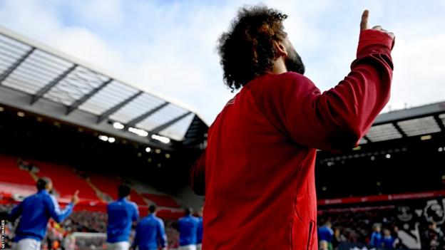 Liverpool forward Mohamed Salah walking out for the Merseyside derby