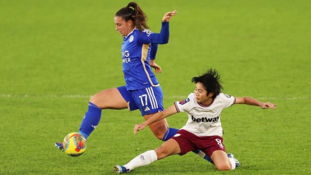 Julie Thibaud of Leicester City is challenged by Riko Ueki of West Ham