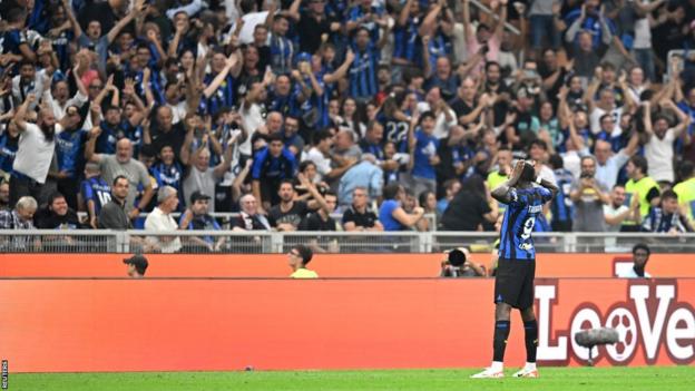 Marcus Thuram celebrates after scoring against AC Milan