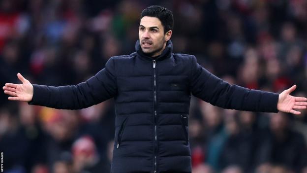 Arsenal manager Mikel Arteta holds out his arms as he stands on the touchline