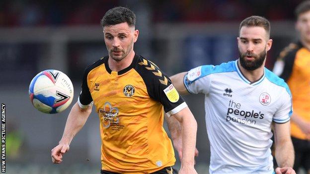 Newport's Padraig Amond is challenged by Joe McNerney