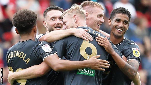 Kyle Naughton celebrates Harry Darling's spectacular goal at Rotherham on the opening day with his team-mates
