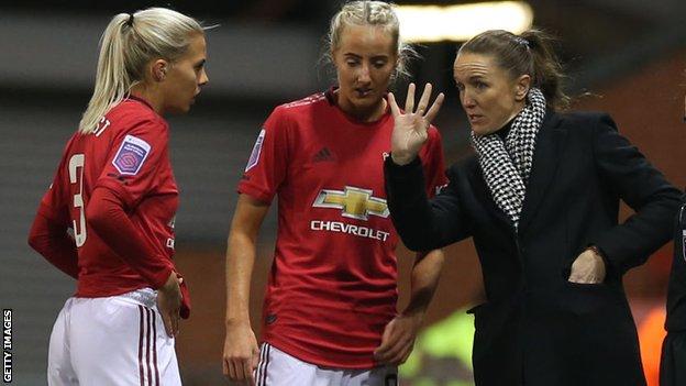 Casey Stoney with Manchester United players Lottie Okvist and Millie Turner