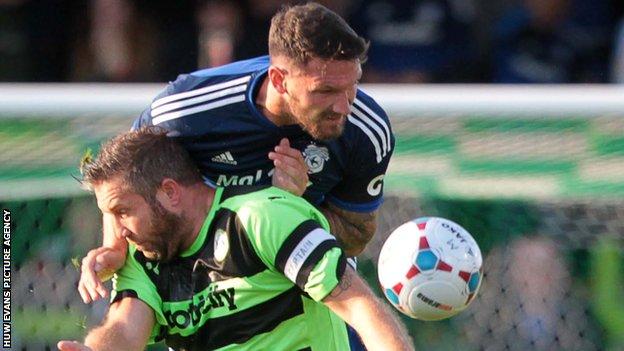 Sean Morrison (right) challenges former Cardiff striker Jon Parkin in a pre-season friendly against Forest Green Rovers