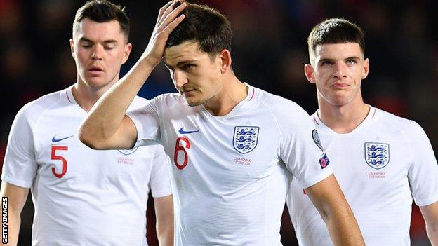 England's Harry Maguire, Michael Keane and Declan Rice