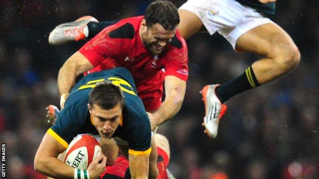 Wales centre Jamie Roberts tackles Handre Pollard of South Africa