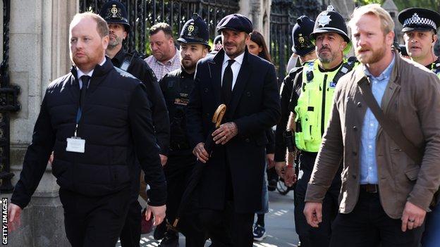 David Beckham leaves Westminster Hall after paying his respects to the Queen