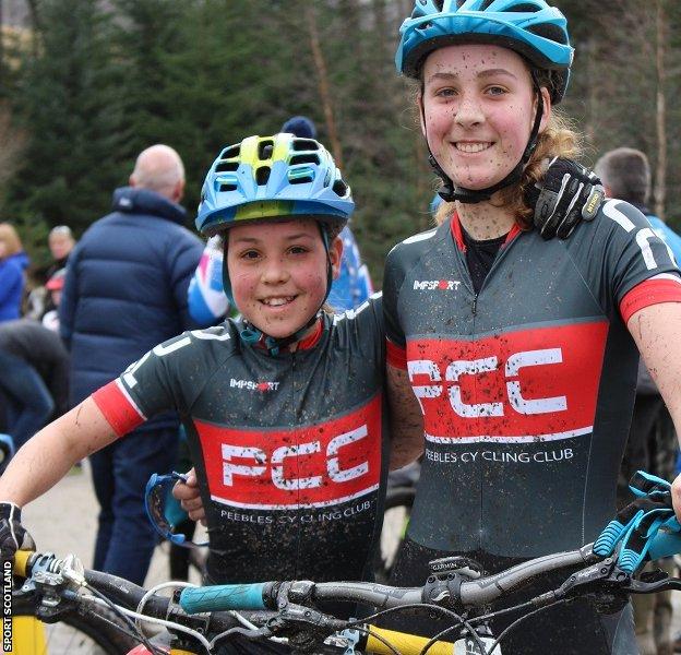 Mud and smiles: Elena and Anna compete regularly in mountain-bike criterium races