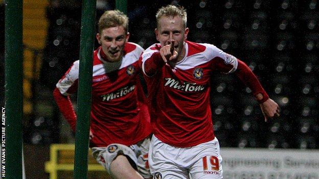Scott Boden celebrates after scoring Newport's third goal at Notts County