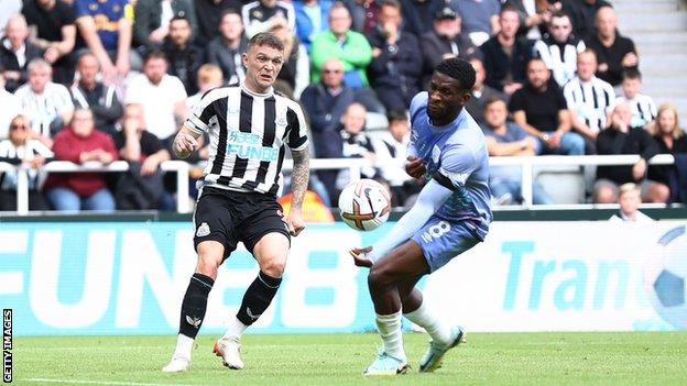 Jefferson Lerma handles a cross from Kieran Tripper to give Newcastle a penalty against AFC Bournemouth
