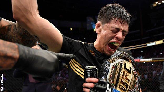 Brandon Moreno celebrates his victory at UFC 263