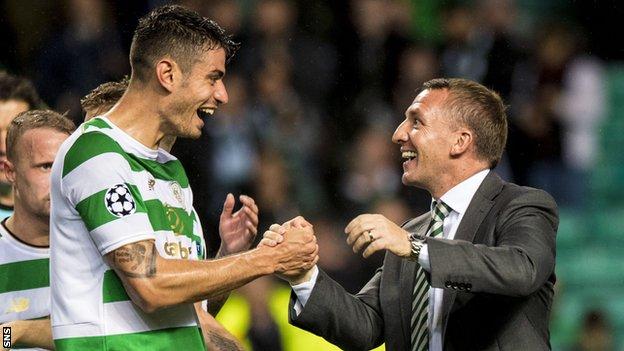 Nir Bitton shakes hands with manager Brendan Rodgers