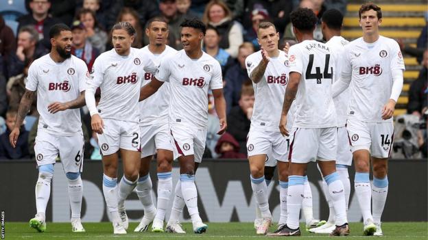 Aston Villa players observe  a extremity   against Burnley astatine  Turf Moor