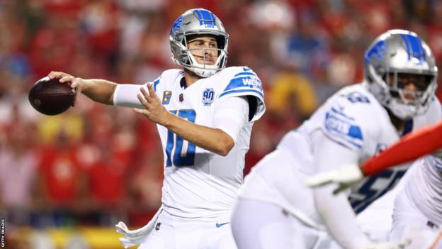 Jared Goff prepares to throw a football