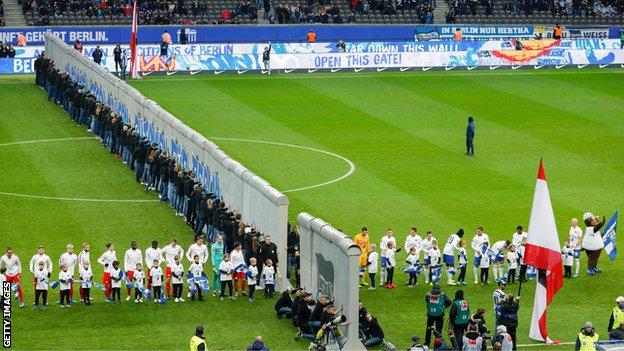 A replica of the Berlin Wall was knocked down on the pitch before Hertha Berlin's 4-2 defeat by RB Leipzig